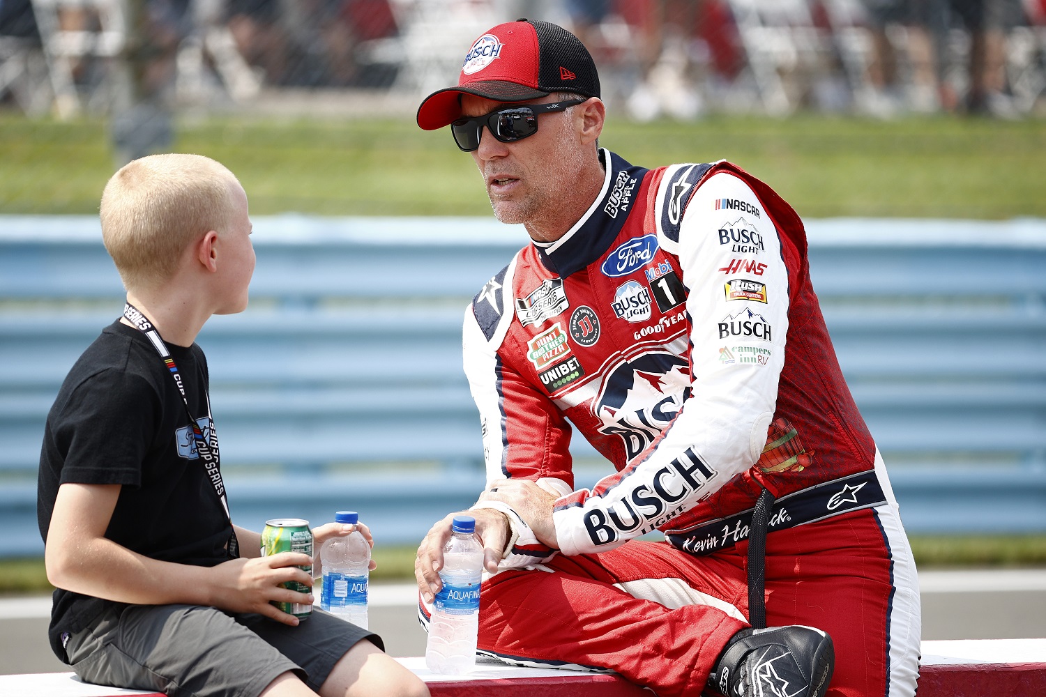Kevin Harvick, driver of the No. 4 Ford, speaks with his son, Keelan, on the grid prior to the NASCAR Cup Series Go Bowling at The Glen at Watkins Glen International on Aug. 8, 2021.