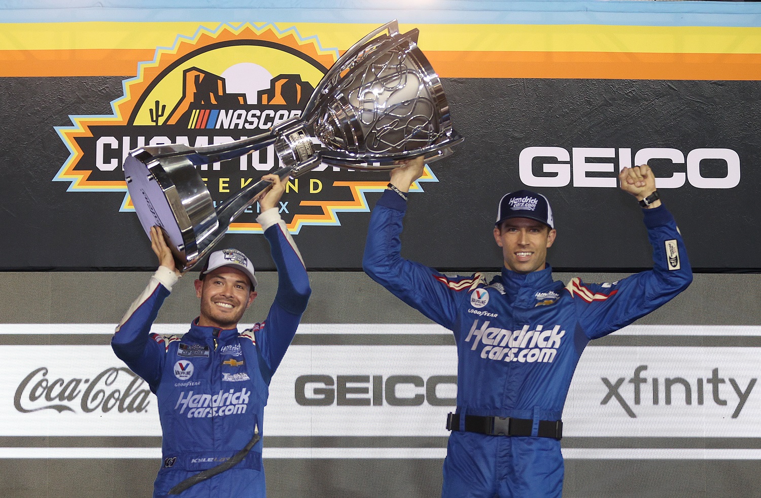 Driver Kyle Larson and crew chief Cliff Daniels celebrate in victory lane after winning the NASCAR Cup Series championship at Phoenix Raceway on Nov. 7, 2021.