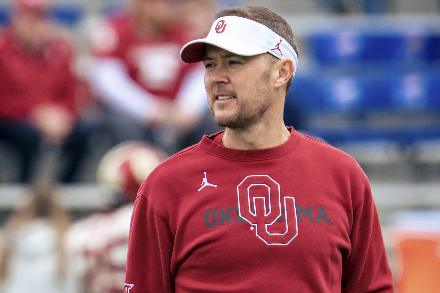 Head coach Lincoln Riley of the Oklahoma Sooners talks to players during warmups before taking on the Kansas Jayhawks on Oct. 23, 2021 in Lawrence, Kansas.