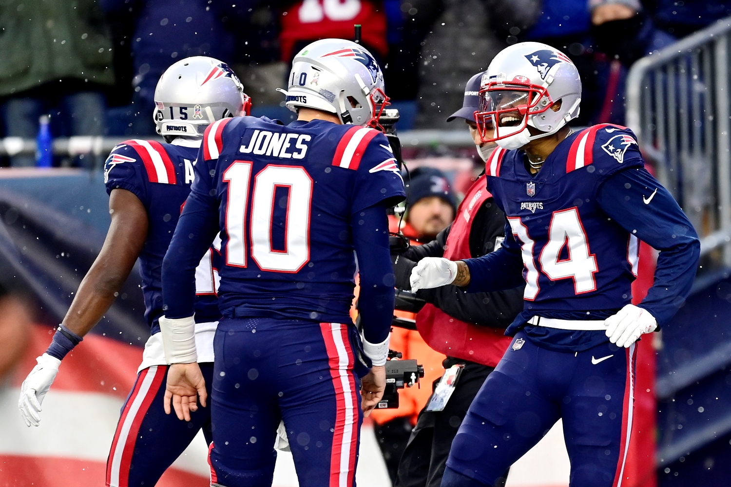 New England Patriots quarterback Mac Jones celebrates throwing a touchdown to Kendrick Bourne against the Tennessee Titans.