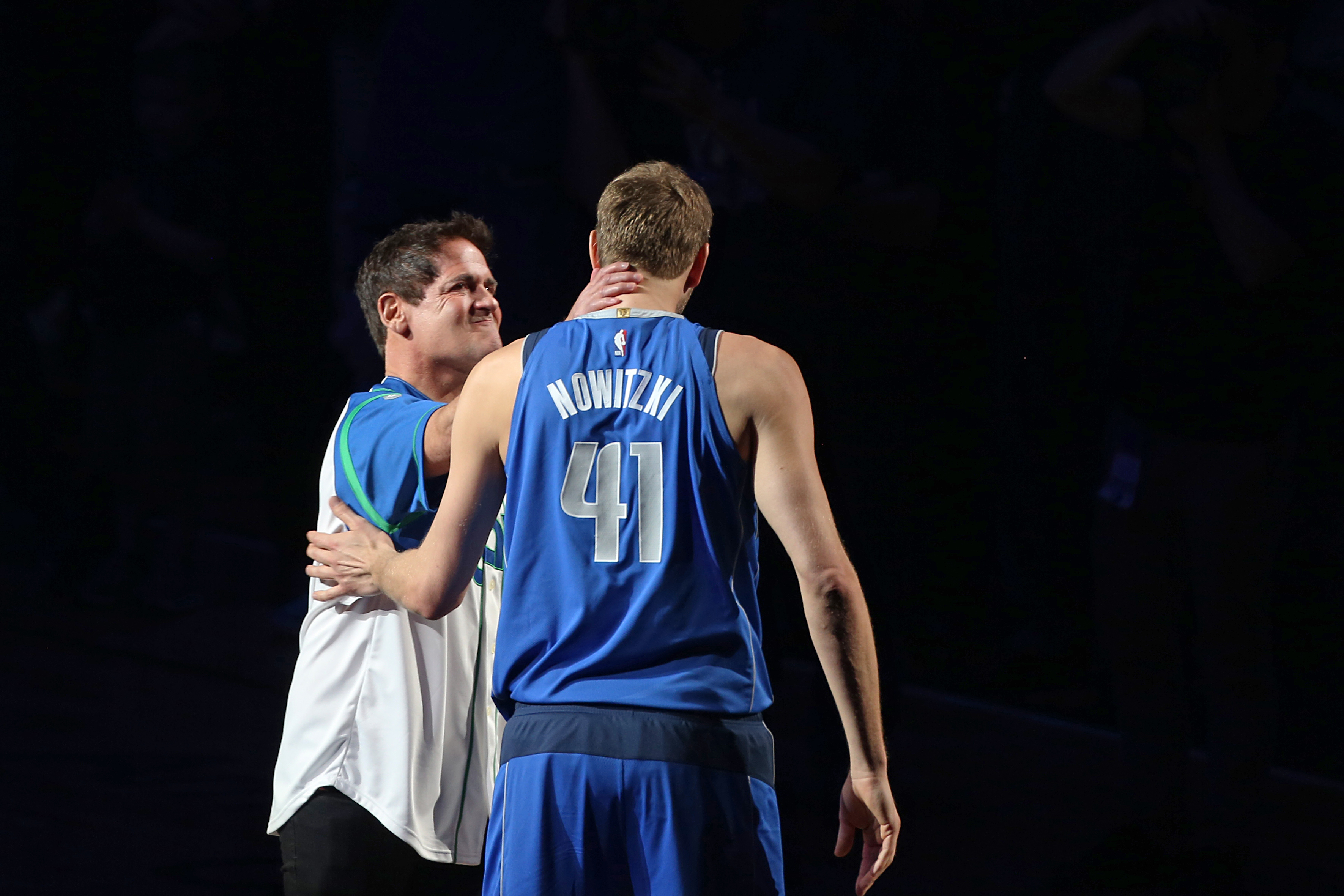 Dallas Mavericks governor Mark Cuban embraces Dirk Nowitzki after Dirk's final home game