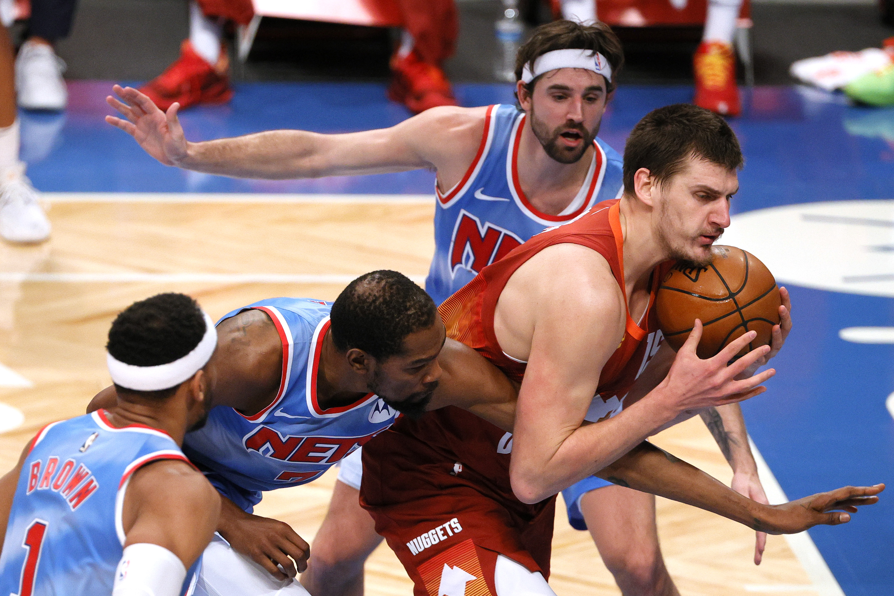 Brooklyn Nets star Kevin Durant defends Denver Nuggets center Nikola Jokic during a game in January 2021