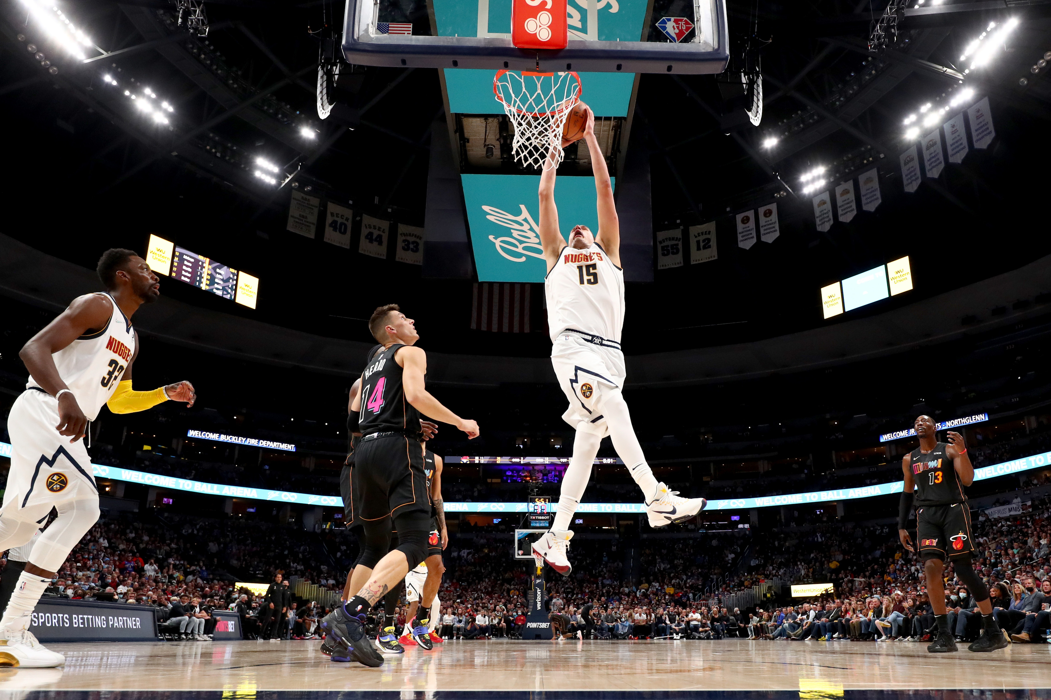Denver Nuggets center Nikola Jokic dunks the ball during a game against the Miami Heat