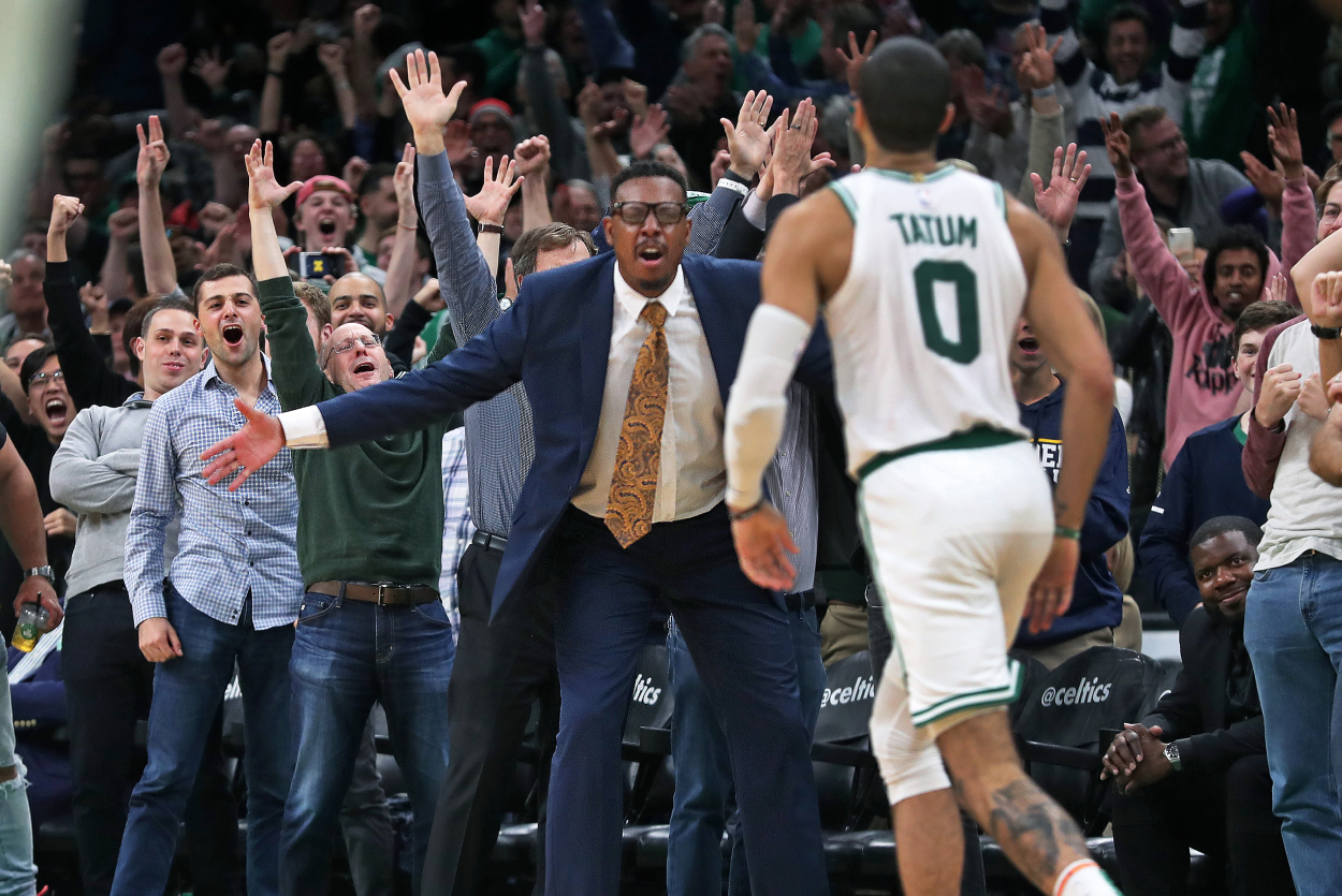 Boston Celtics' Jayson Tatum brings the crowd, including former Celtics player Paul Pierce out of their seats.
