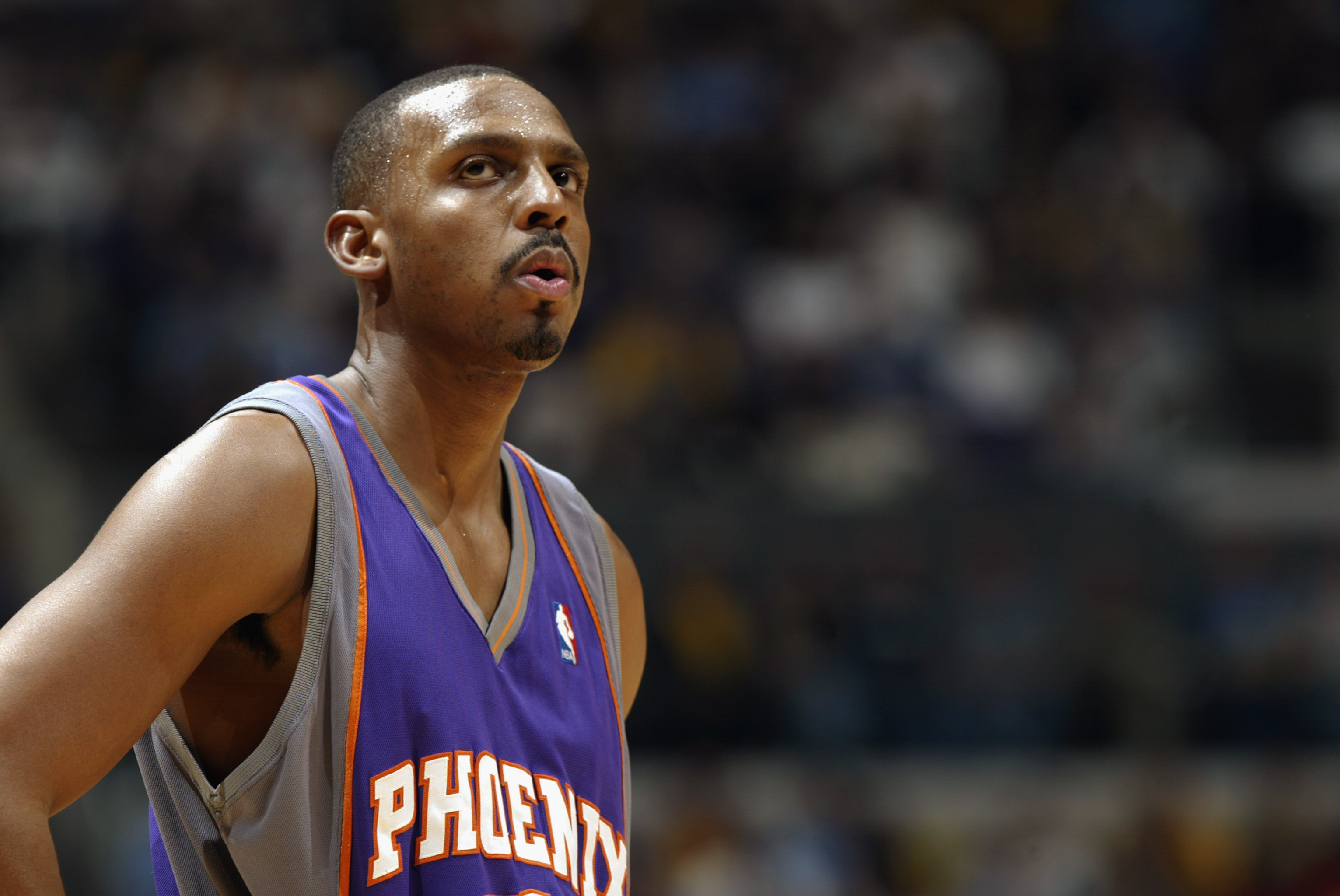 Former Phoenix Suns guard Penny Hardaway reacts during a game in January 2003