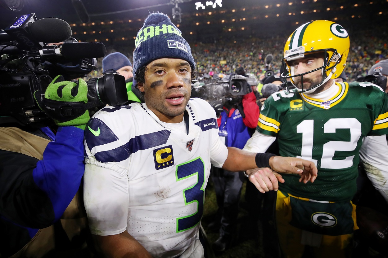 Russell Wilson and Aaron Rodgers meet at midfield.