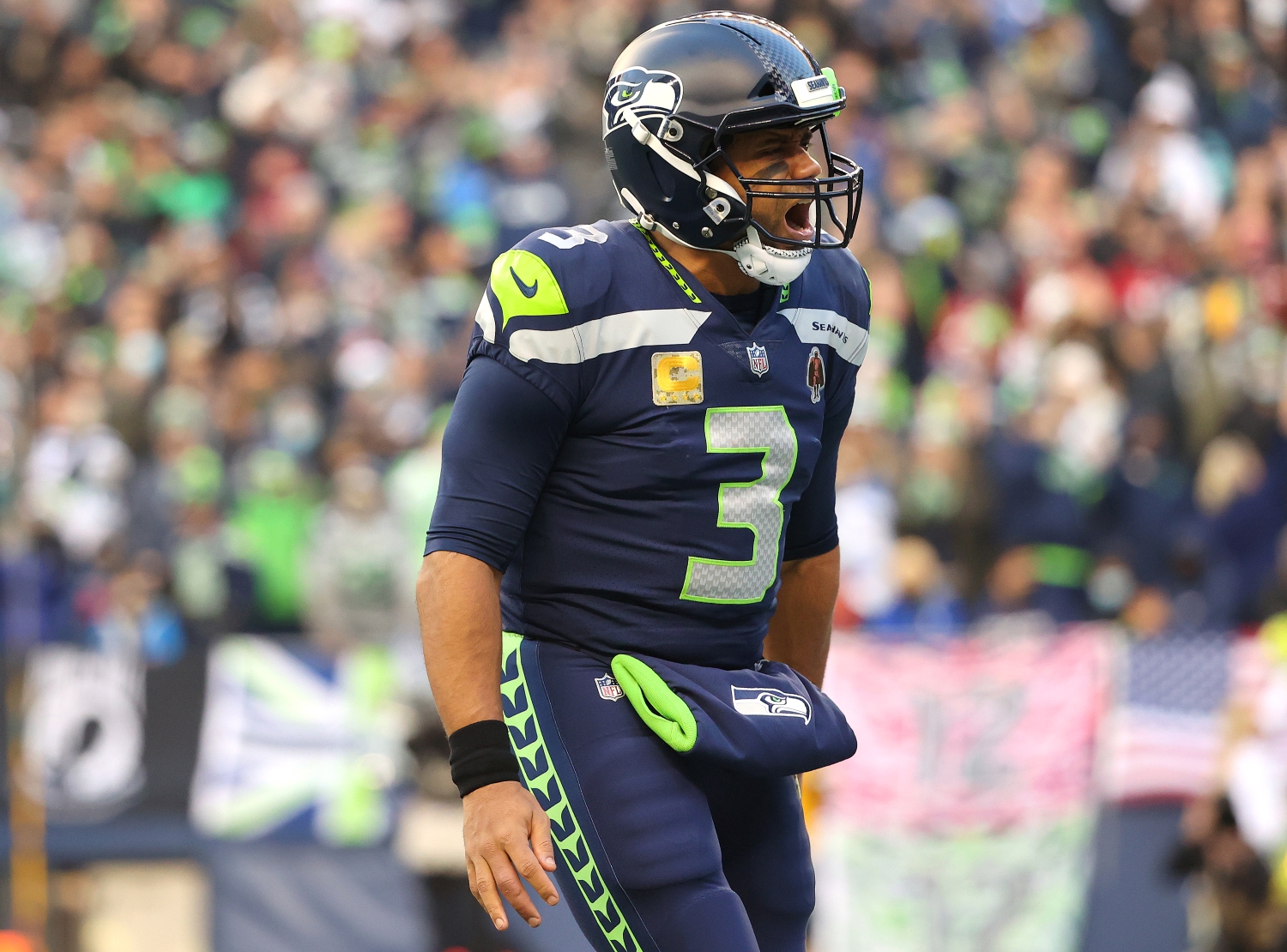 Seattle Seahawks quarterback Russell Wilson reacts after throwing a touchdown pass.