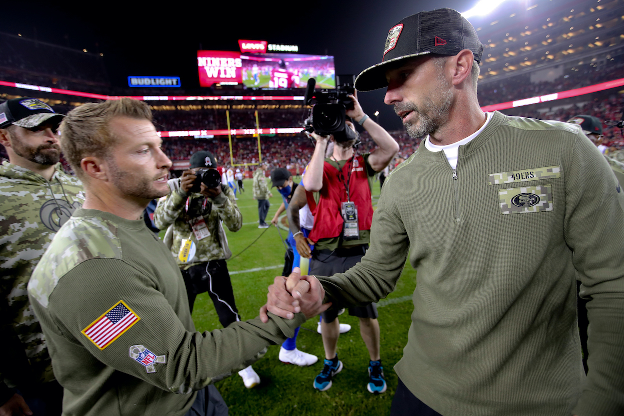 Head Coach Sean McVay of the Los Angeles Rams and Head Coach Kyle Shanahan of the San Francisco 49ers shake hands on the field after the game at Levi's Stadium on November 15, 2021 in Santa Clara, California. The 49ers defeated the Rams 31-10.
