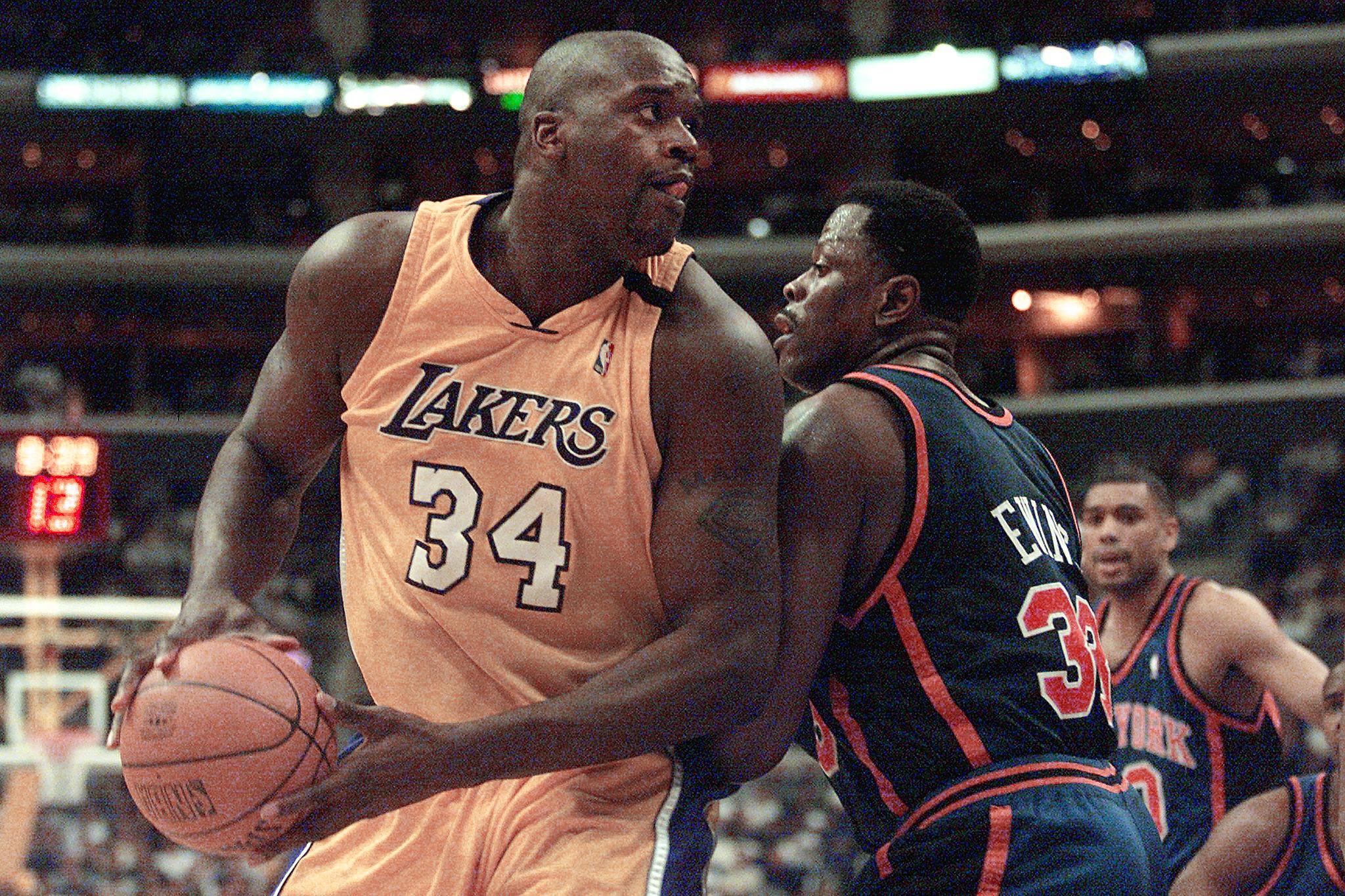 Former Los Angeles Lakers star Shaquille O'Neal backs down against New York Knicks legend Patrick Ewing during a game in 2000