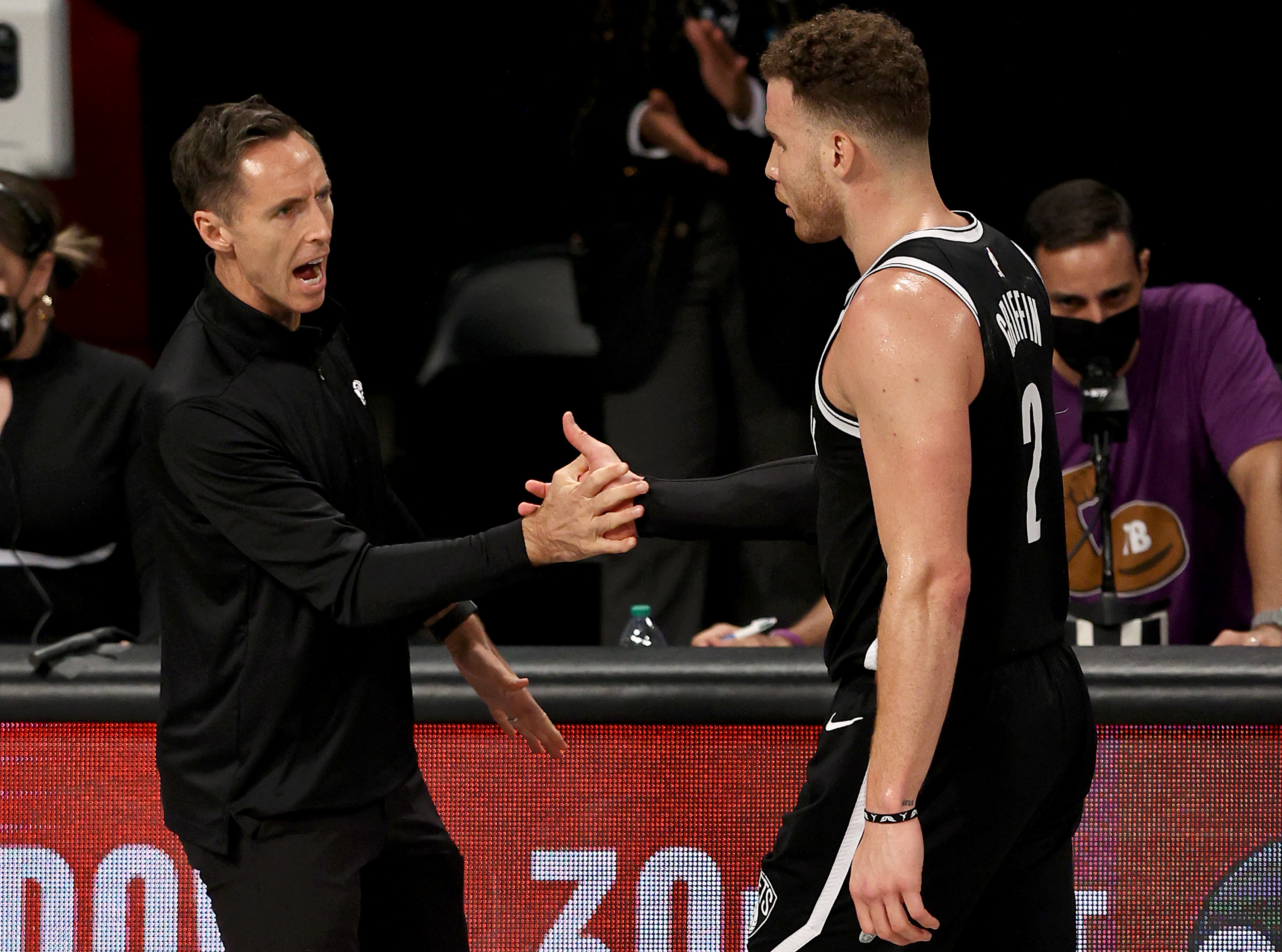 Brooklyn Nets head coach Steve Nash high-fives Blake Griffin during the 2021 NBA Playoffs