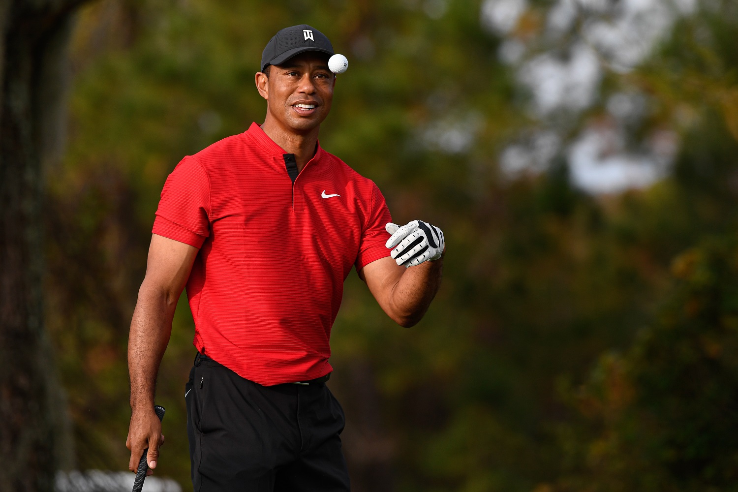 Tiger Woods catches a ball on the range during the final round of the PGA Tour Champions PNC Championship at Ritz-Carlton Golf Club on Dec. 20, 2020, in Orlando, Florida.