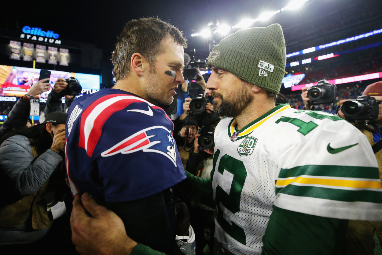 Tom Brady of the New England Patriots talks with Aaron Rodgers of the Green Bay Packers.
