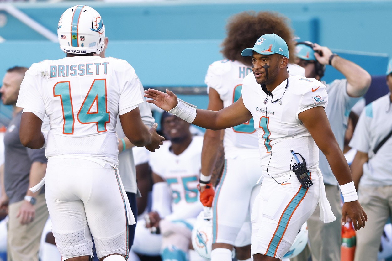 Tua Tagovailoa celebrates with Jacob Brissett