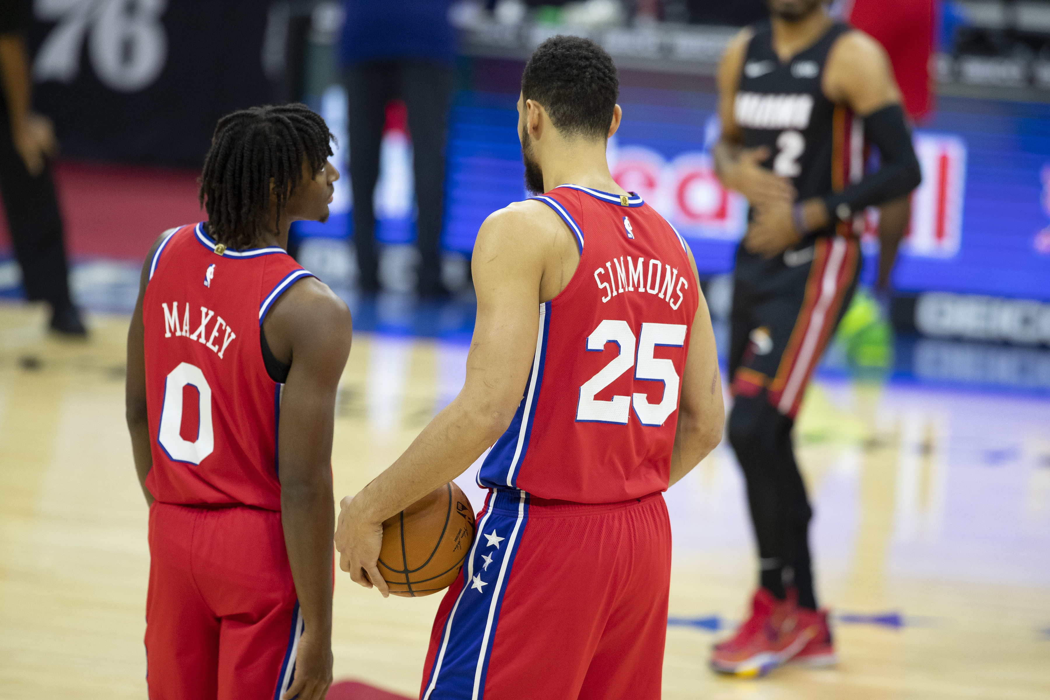 Philadelphia 76ers teammates Tyrese Maxey and Ben Simmons talk during a game in January 2021