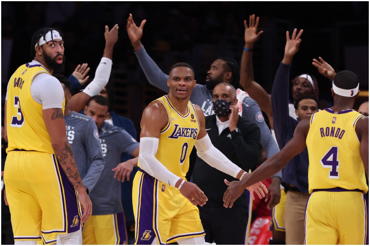 Los Angeles Lakers players Anthony Davis, Russell Westbrook, and Rajon Rondo after a play.