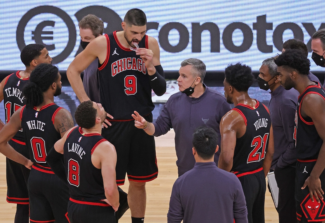 Chicago Bulls head coach Billy Donovan talks with his team during a time out.