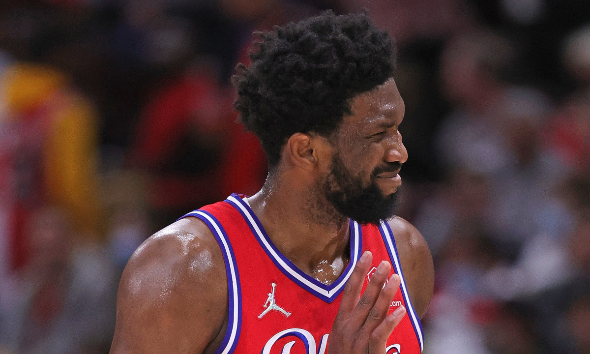 Joel Embiid waves goodbye to the United Center crowd after hitting a game-sealing 3-pointer for the Philadelphia 76ers against the Chicago Bulls.