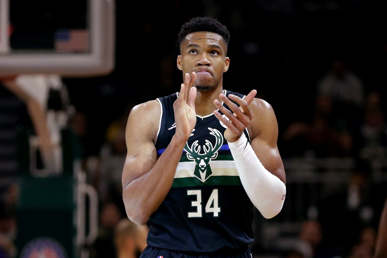 Giannis Antetokounmpo of the Milwaukee Bucks walks down the floor after a basket.