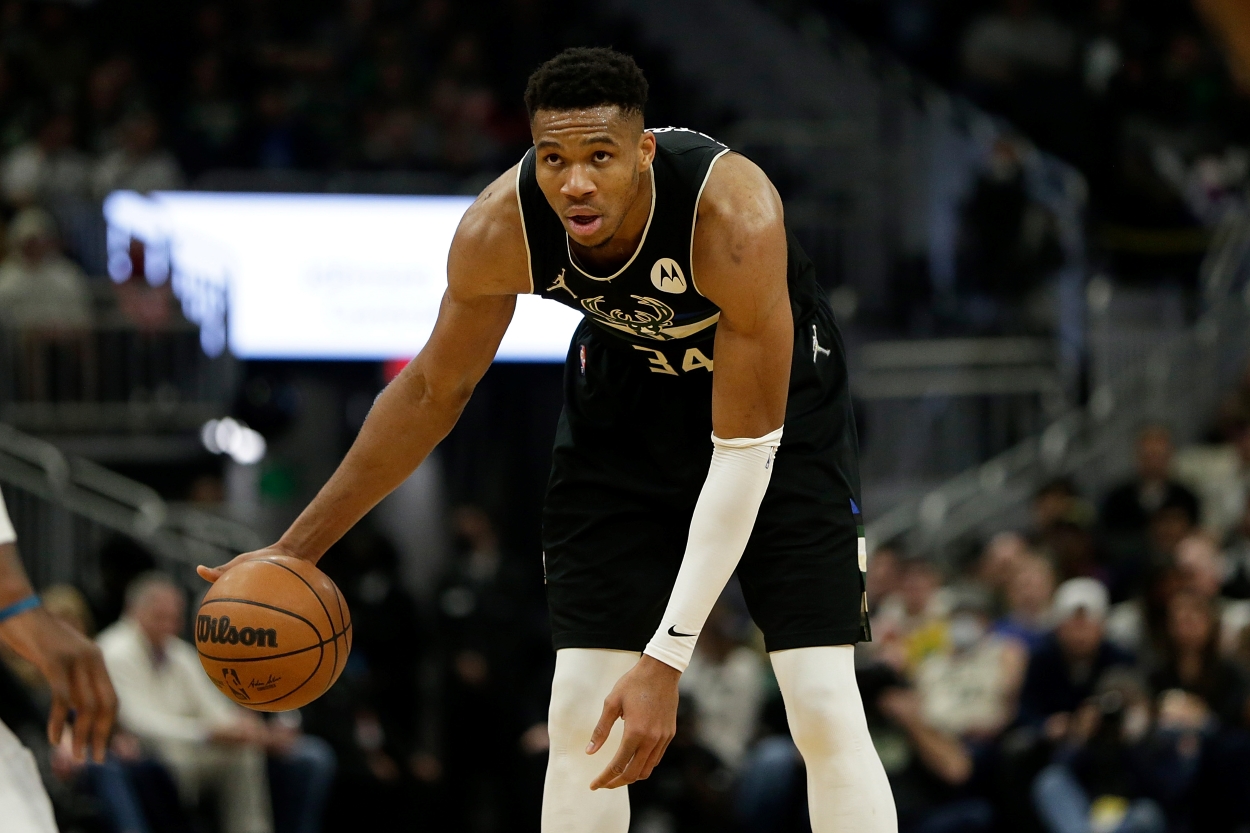 Giannis Antetokounmpo of the Milwaukee Bucks dribbles near half court.