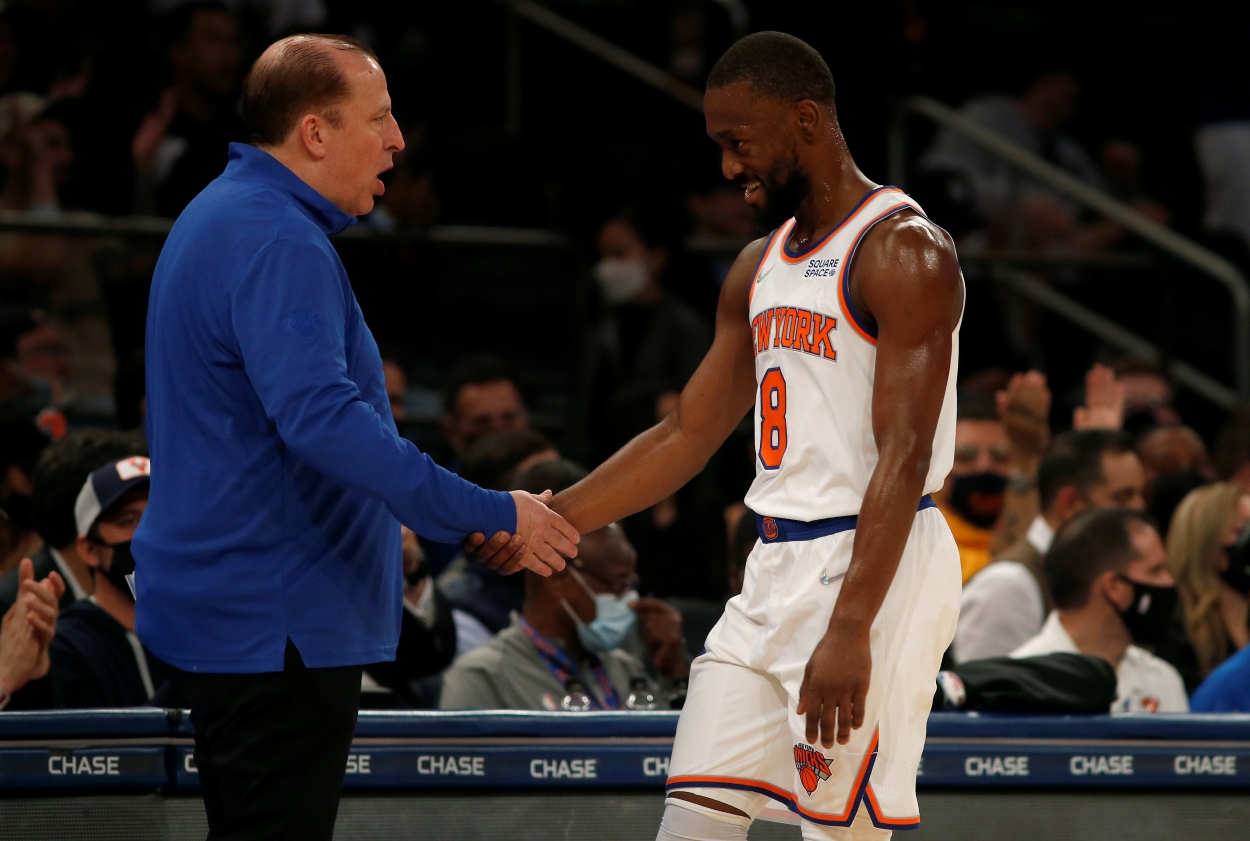 New York Knicks point guard Kemba Walker, who could possibly be on the move in a deal for John Wall, shakes hands with head coach Tom Thibodeau.