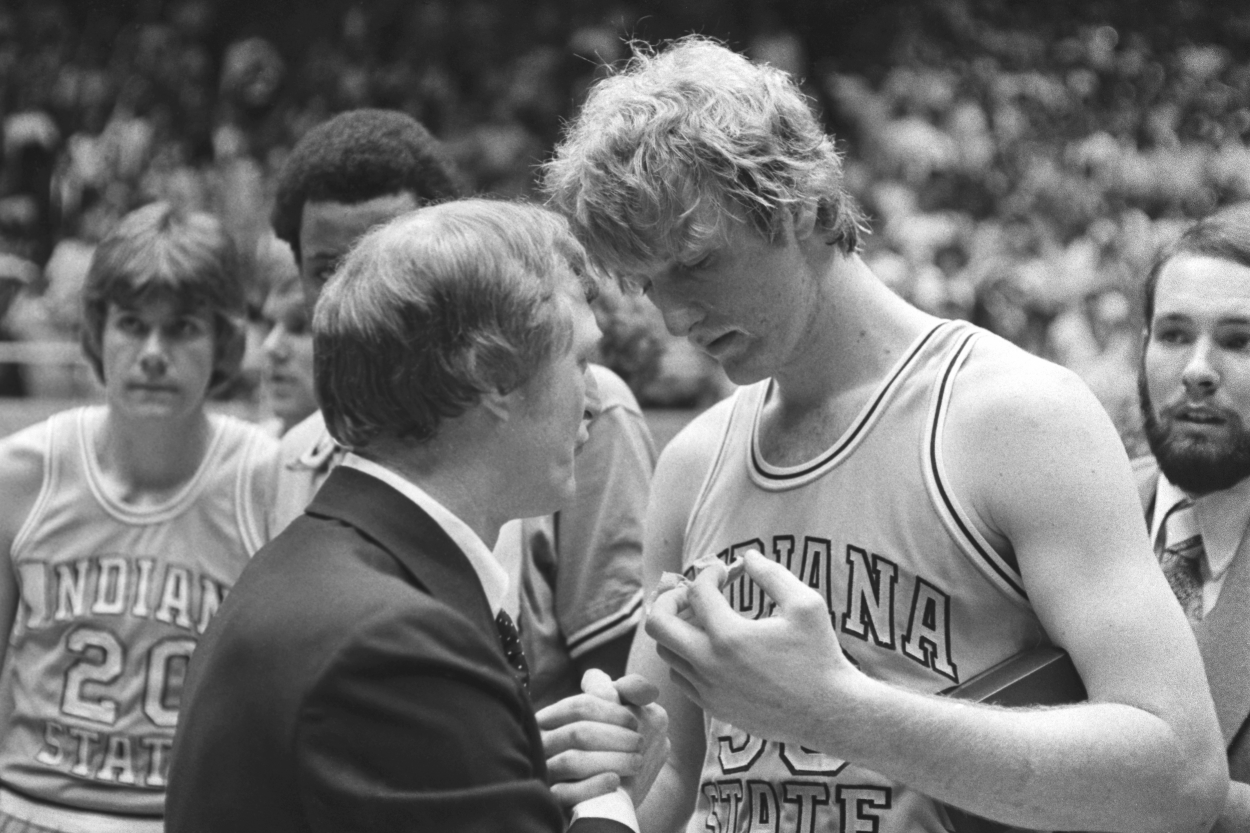 Larry Bird's stats at Indiana State will never be broken as he shakes hands with head coach Bill Hodges.