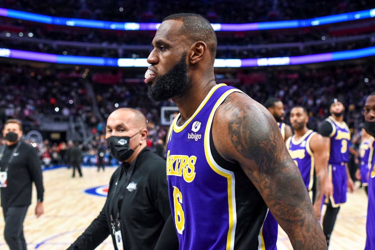 LeBron James of the Los Angeles Lakers walks off the floor after getting ejected following a fight with Isaiah Stewart of the Detroit Pistons.