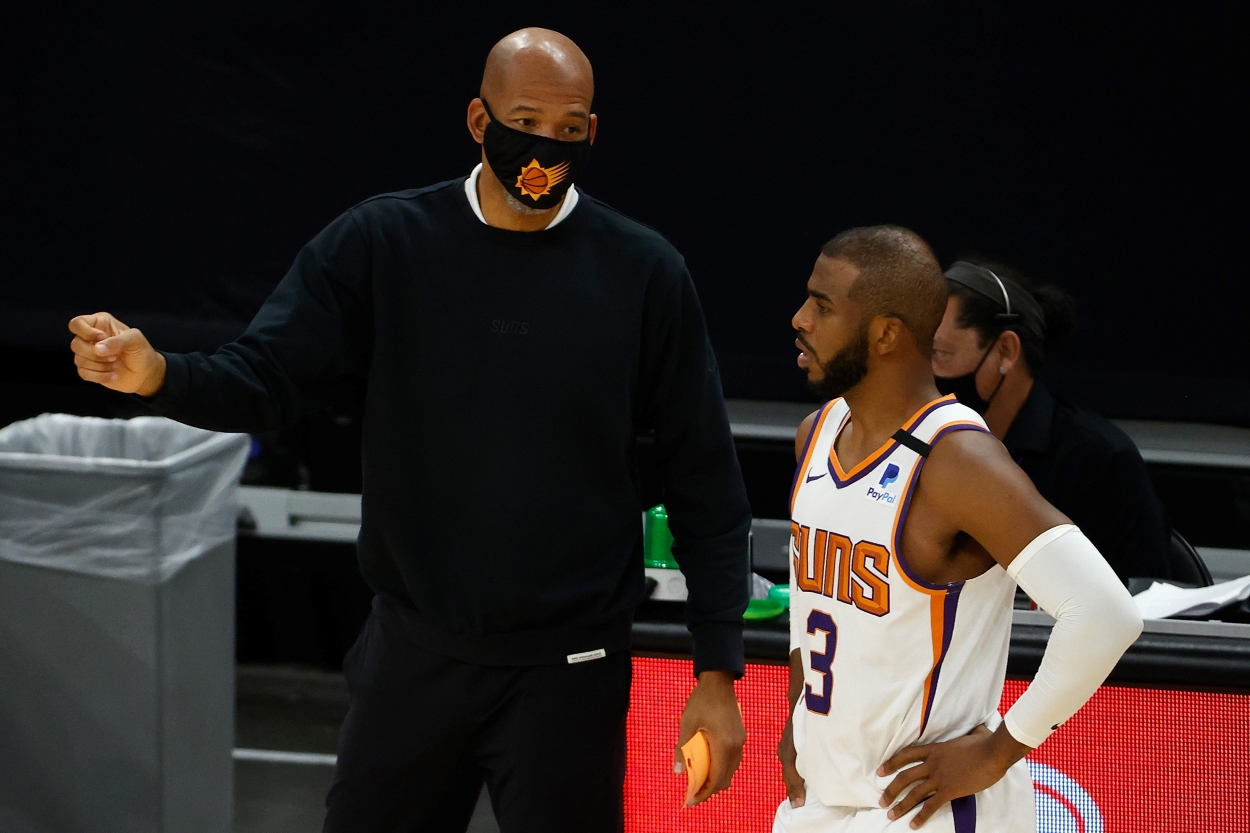 Monty Williams and Chris Paul of the Phoenix Suns, who are hot on the heels of the Golden State Warriors in the Western Conference standings, talk during a time out.
