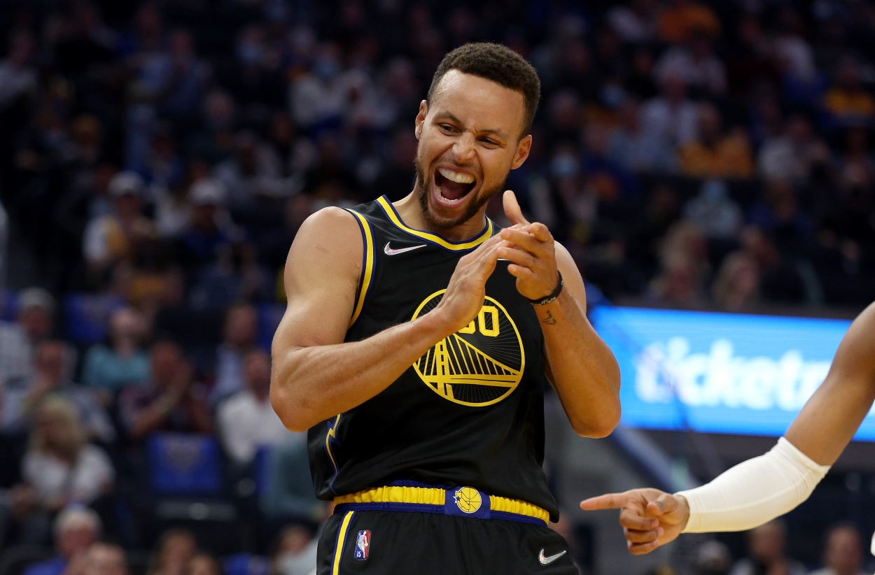 Stephen Curry of the Golden State Warriors reacts to a play in a game against the Charlotte Hornets.