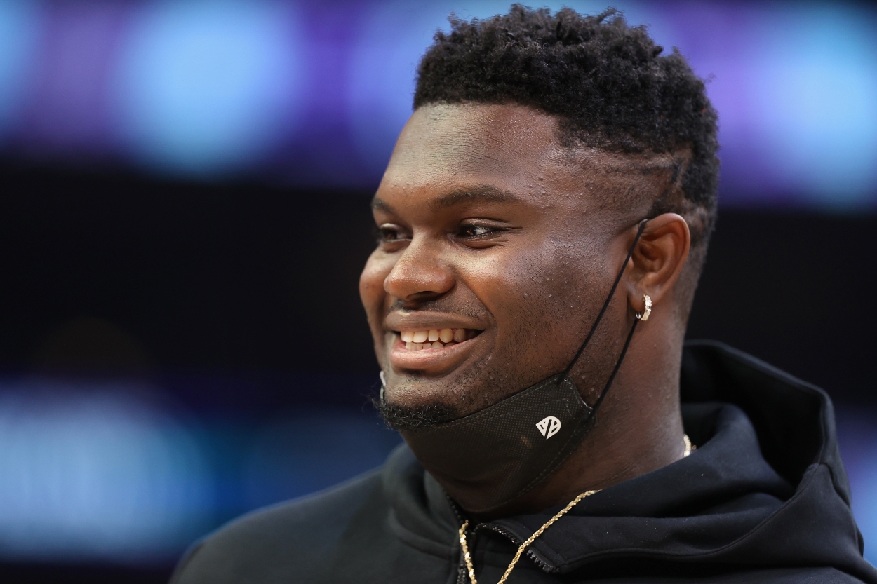 Zion Williamson of the New Orleans Pelicans smiles during a break in the action.