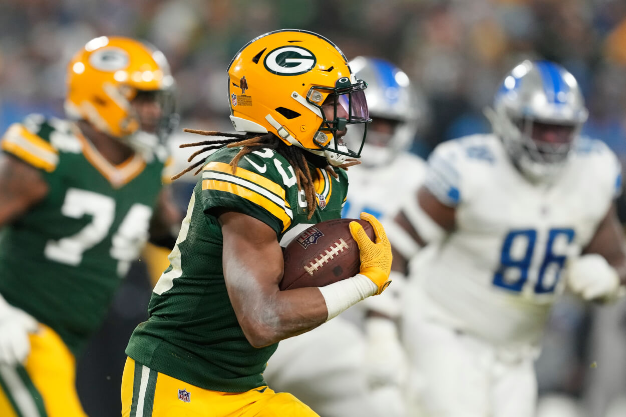 Aaron Jones of the Green Bay Packers runs with the ball against the Detroit Lions.