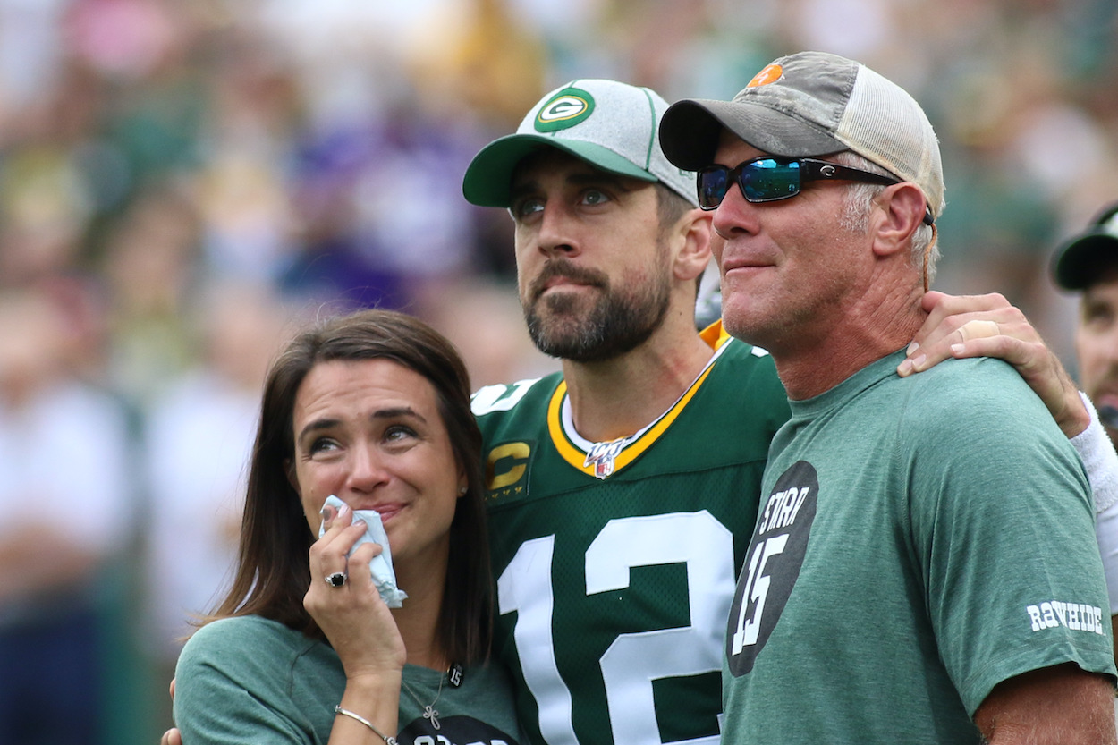 Green Bay Packers quarterback Aaron Rodgers watches a tribute to Bart Starr with Leann Nelson and Brett Favre during a game between the Green Bay Packers and the Minnesota Vikings on September 15, 2019 at Lambeau Field in Green Bay, WI.