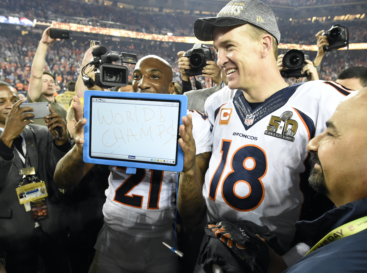 Aqib Talib of the Denver Broncos holds up an iPad with "World Champs" written on it during Manning's interviews after the Broncos win. The Denver Broncos played the Carolina Panthers in Super Bowl 50 at Levi's Stadium in Santa Clara, Calif. on February 7, 2016.