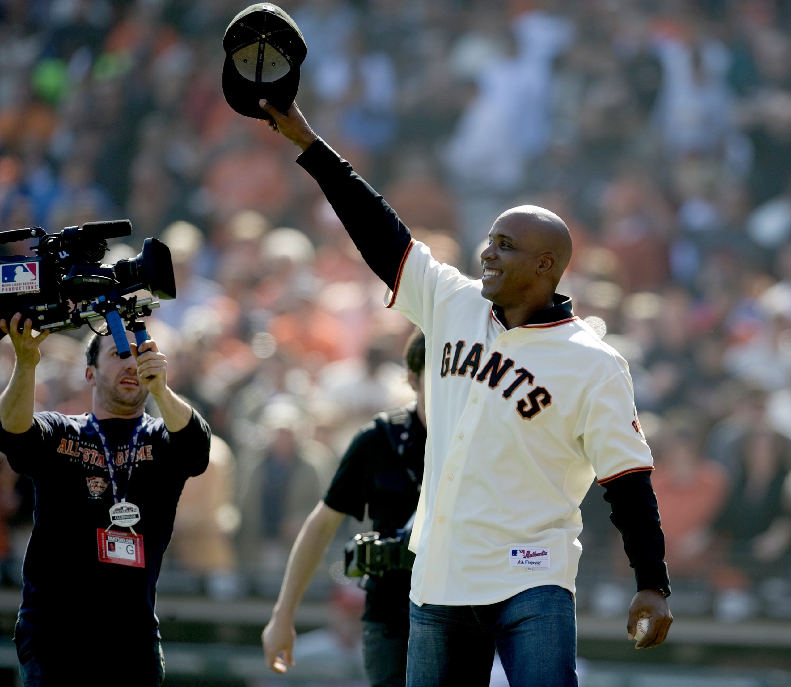 Former San Francisco Giants star Barry Bonds is all smiles after throwing out the ceremonial first pitch in 2010.