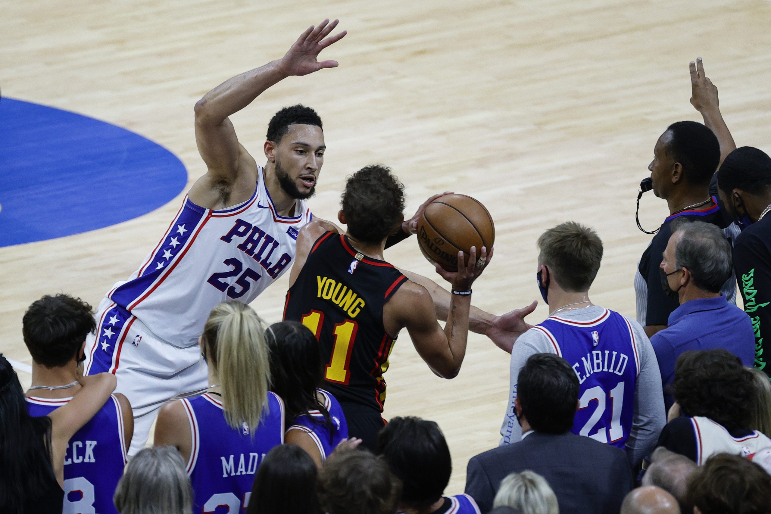 Ben Simmons of the Philadelphia 76ers guards Trae Young of the Atlanta Hawks.
