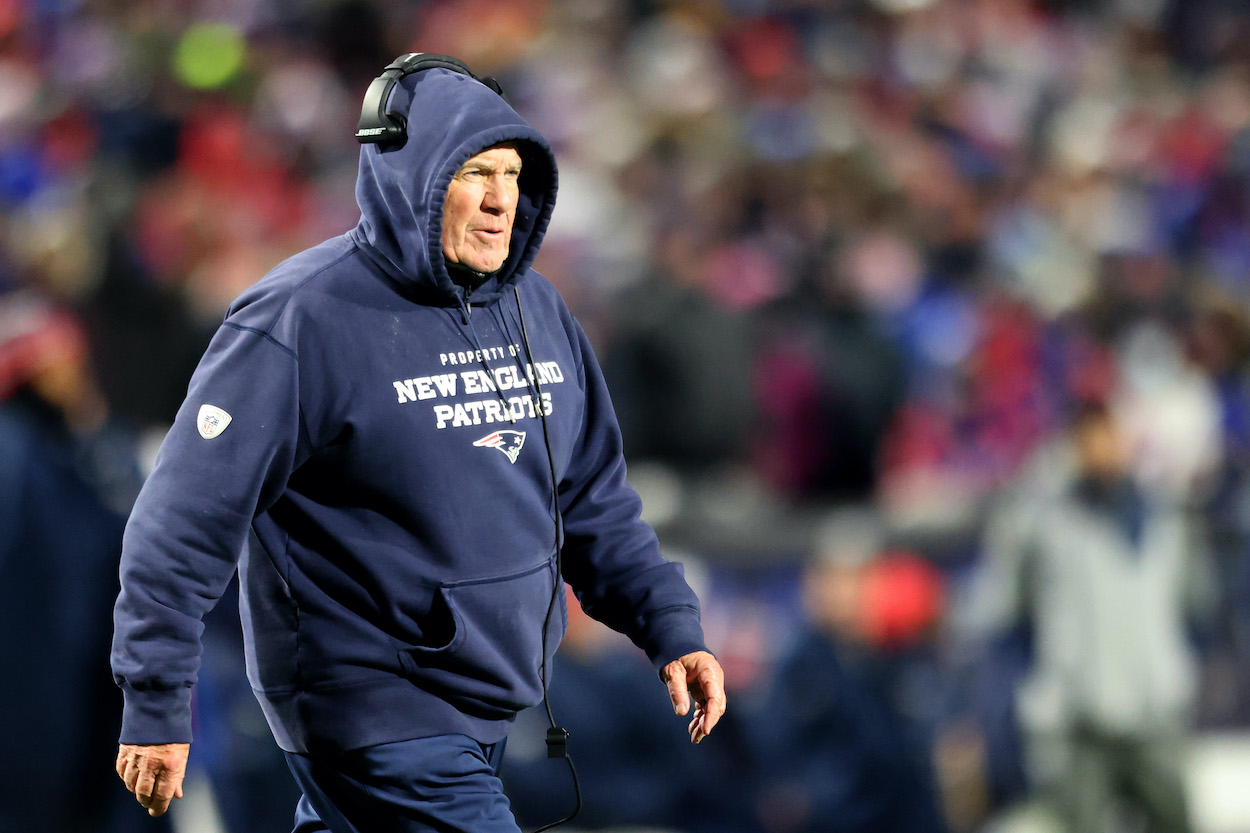 Head Coach Bill Belichick of the New England Patriots walks on the field during an injury timeout during the fourth quarter against the Buffalo Bills at Highmark Stadium on December 06, 2021 in Orchard Park, New York.