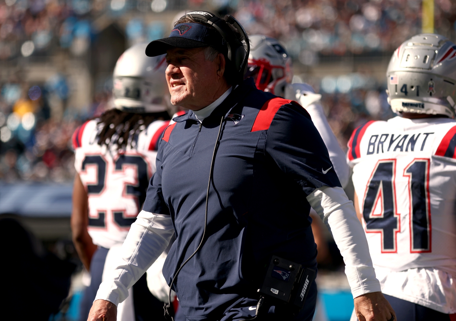 New England Patriots head coach Bill Belichick turns to talk to his team during a game.
