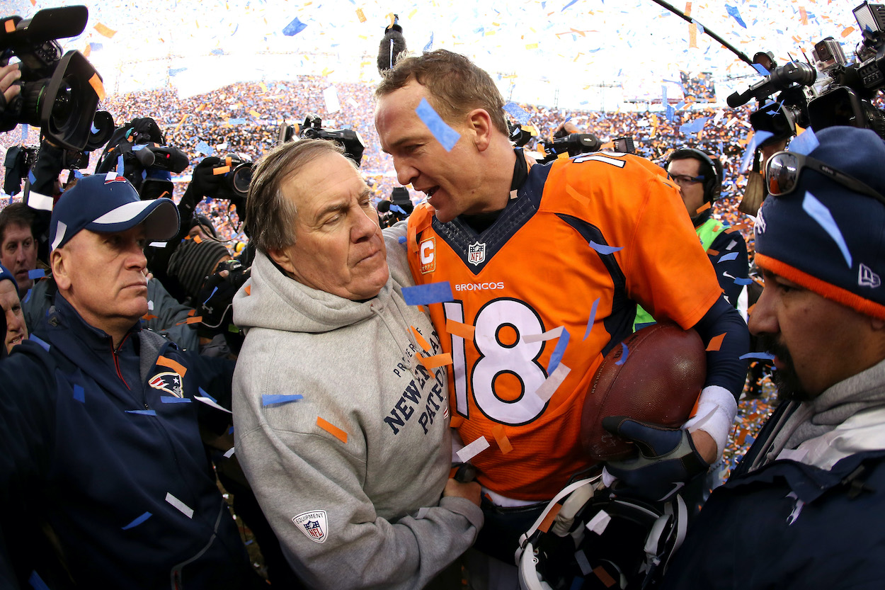 Peyton Manning of the Denver Broncos and head coach Bill Belichick of the New England Patriots — who now coaches Mac Jones — speak after the AFC Championship game at Sports Authority Field at Mile High on January 24, 2016 in Denver, Colorado. The Broncos defeated the Patriots 20-18.