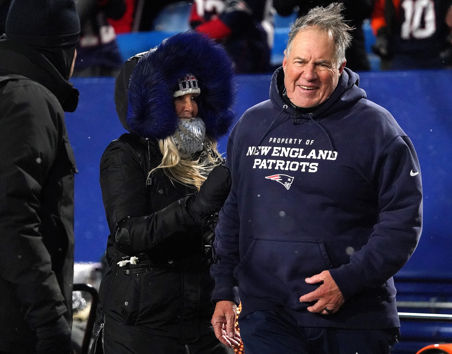 New England Patriots head coach Bill Belichick stands with his partner, Linda Holliday, following a win over the Buffalo Bills.