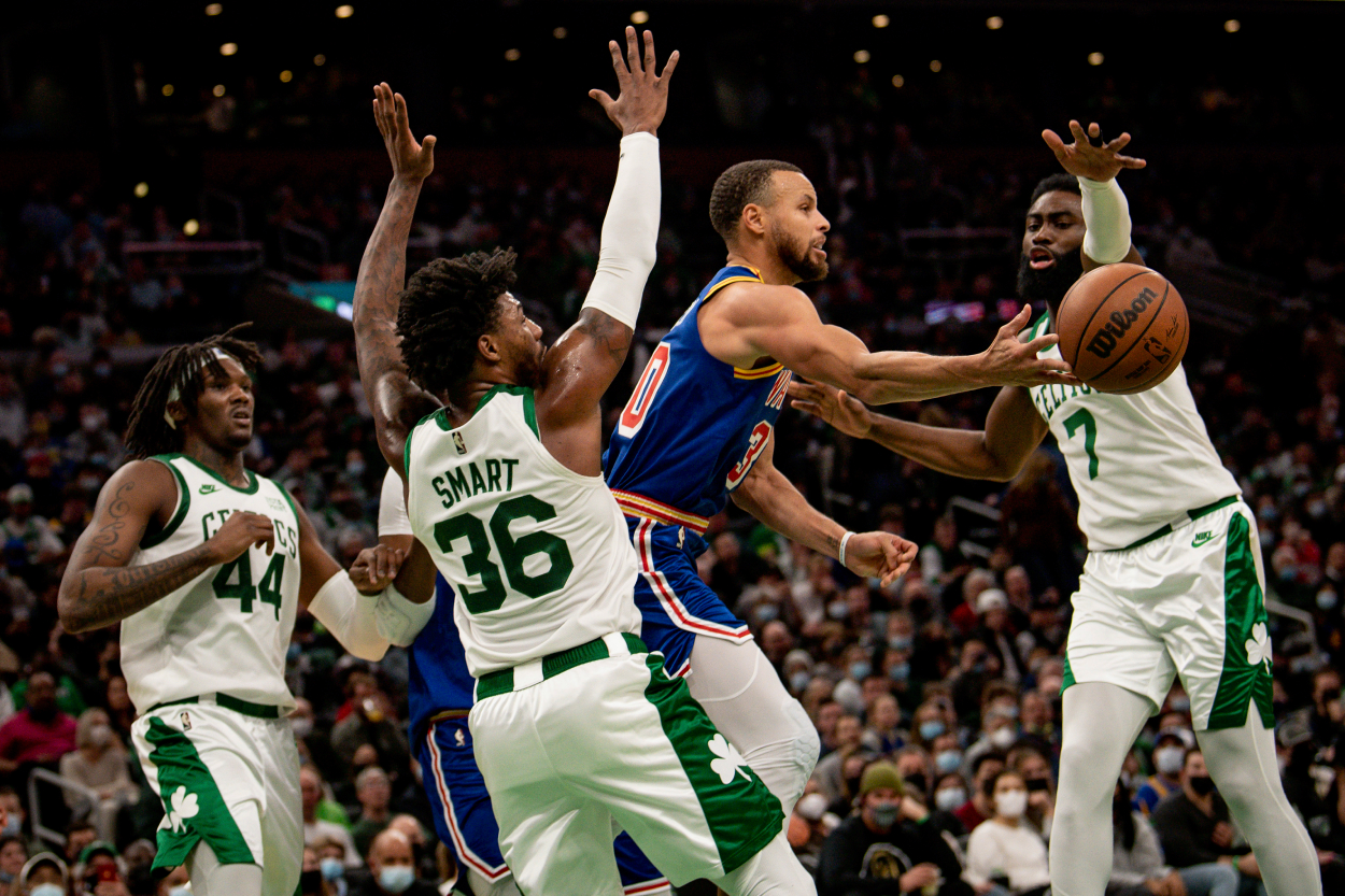 Stephen Curry of the Golden State Warriors attempts to rebound the ball.