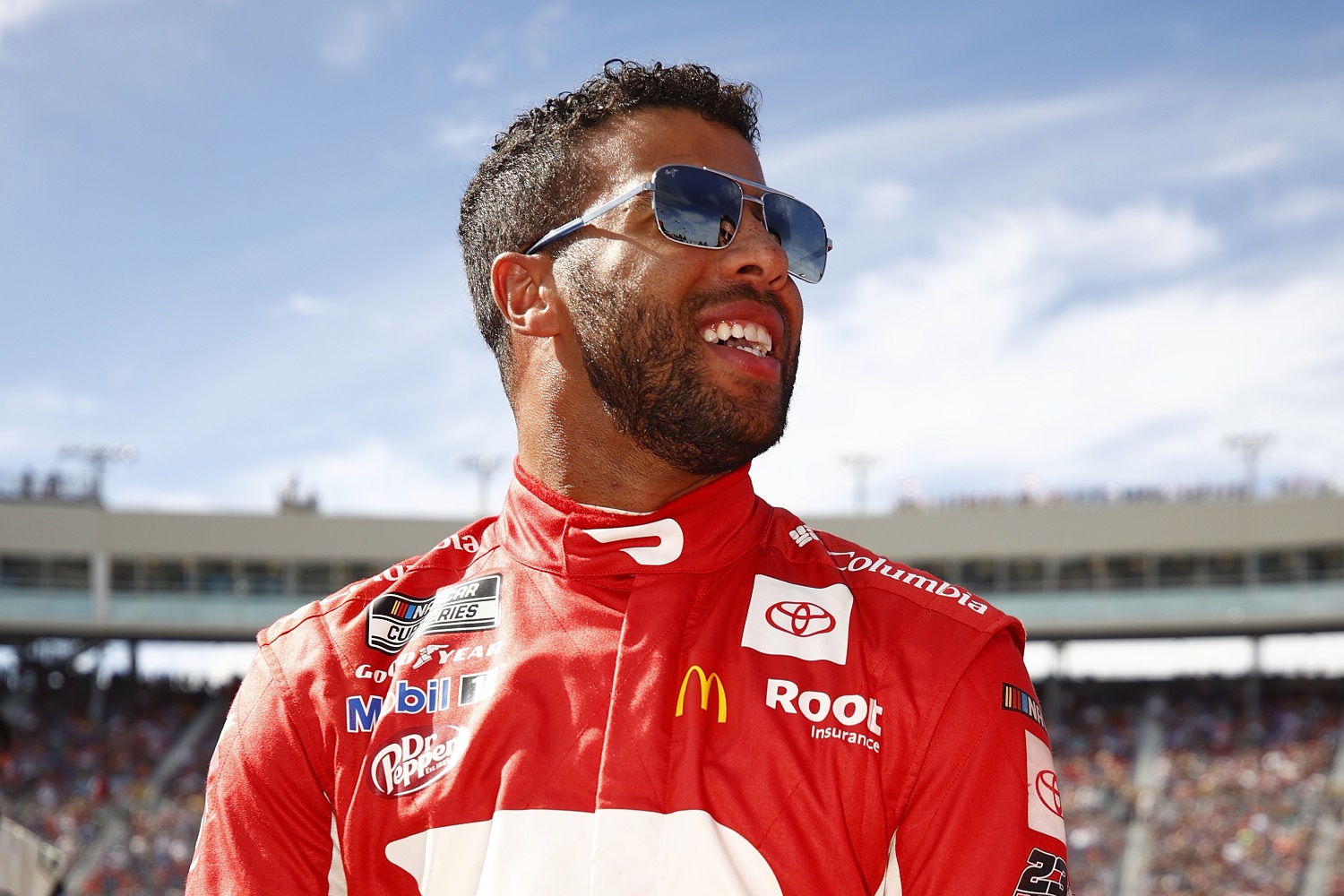 Bubba Wallace waits on the grid prior to the NASCAR Cup Series Championship at Phoenix Raceway on Nov. 7, 2021. An early wreck took Wallace out of the race after 25 laps, ending his first season with 23XI Racing.  Jared C. Tilton/23XI Racing via Getty Images