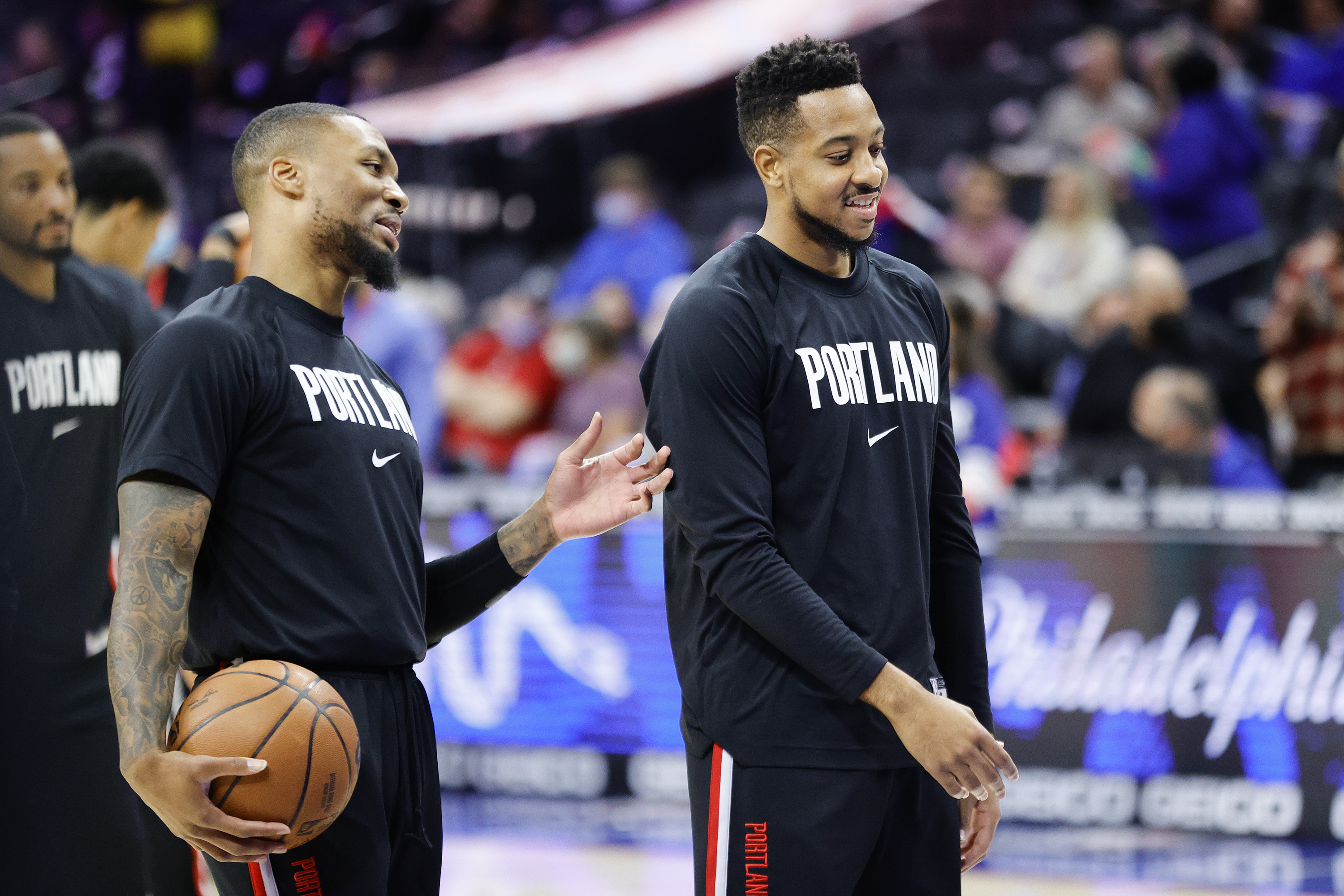 Portland Trail Blazers guards Damian Lillard and CJ McCollum share a laugh before a November game against the Philadelphia 76ers