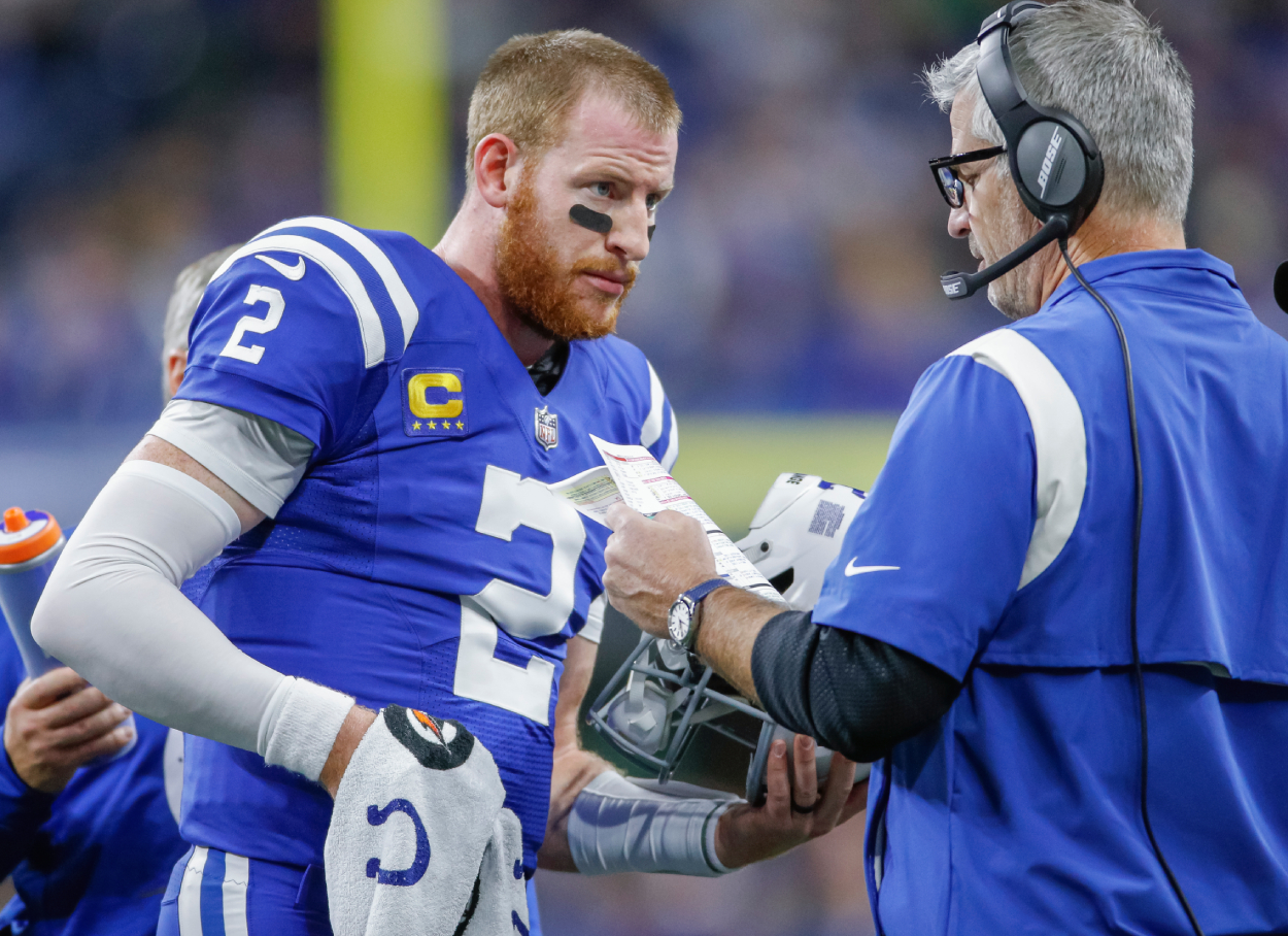 Indianapolis Colts quarterback Carson Wentz and head coach Frank Reich during a game against the Jets in 2021.