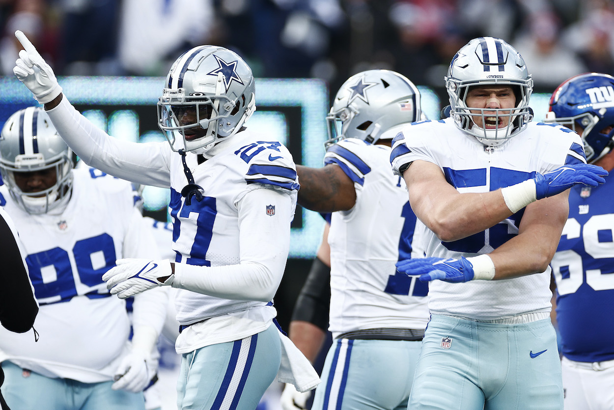 Leighton Vander Esch and Jayron Kearse of the Dallas Cowboys react after a defensive stop during the third quarter against the New York Giants at MetLife Stadium on December 19, 2021 in East Rutherford, New Jersey. The Dallas Cowboys clinch the NFC East with a win in Week 16.