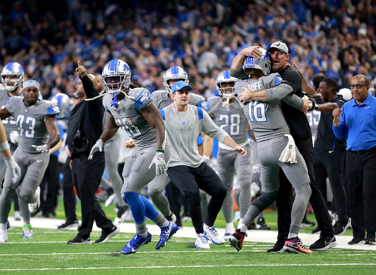 The Detroit Lions celebrate their first win of the 2021 season