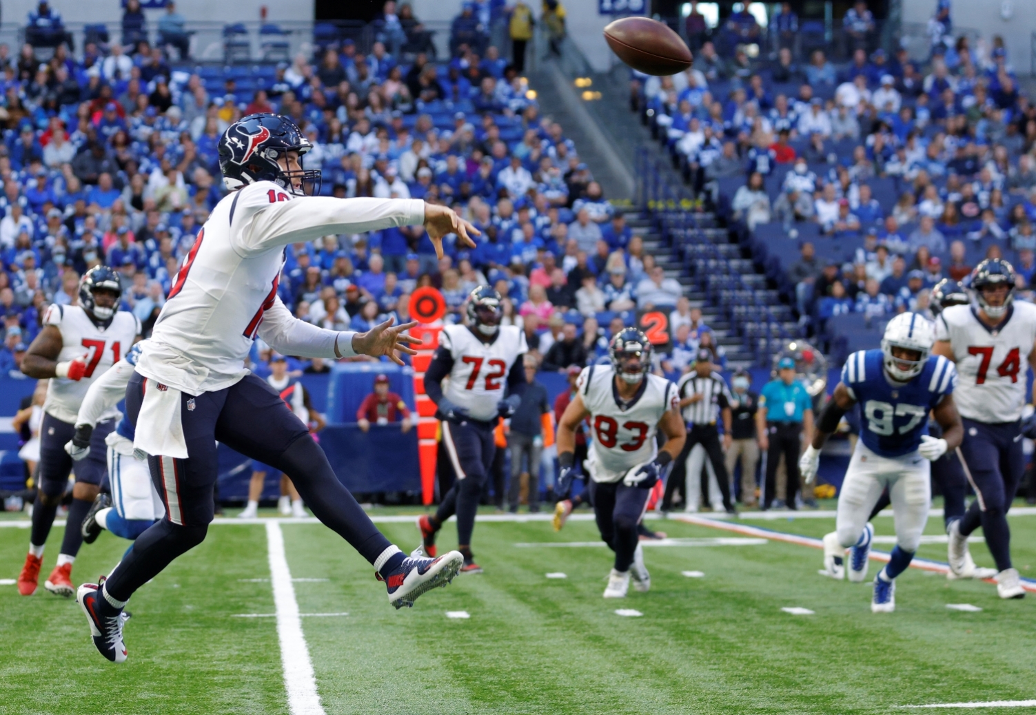 Houston Texans QB Davis Mills attempts a pass during a game.