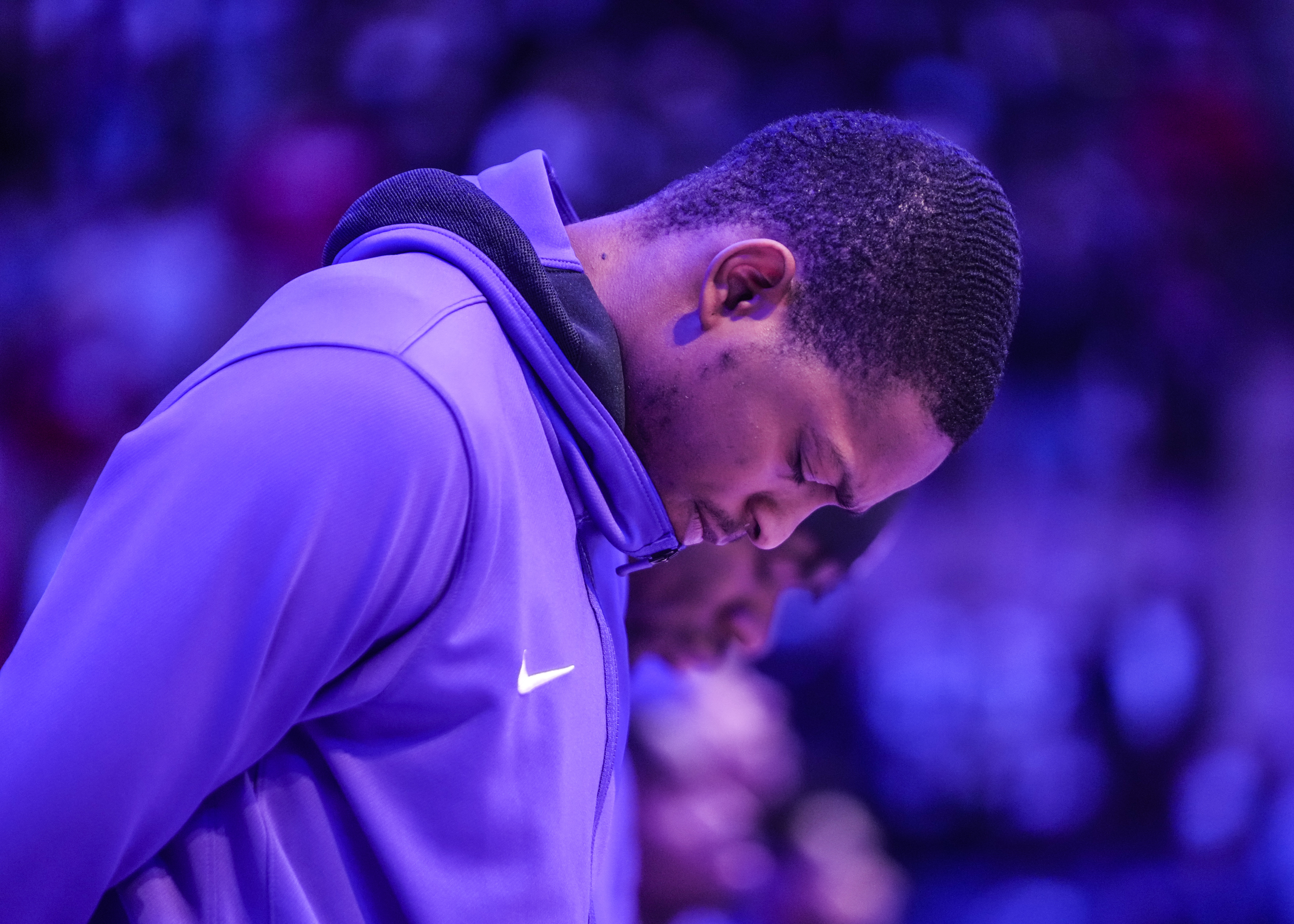 Sacramento Kings guard De'Aaron Fox listens to the national anthem before a game against the Toronto Raptors