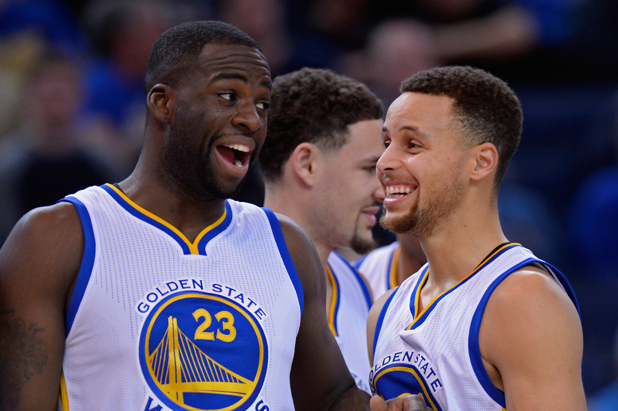 Golden State Warriors stars Draymond Green and Stephen Curry during a game in 2016.
