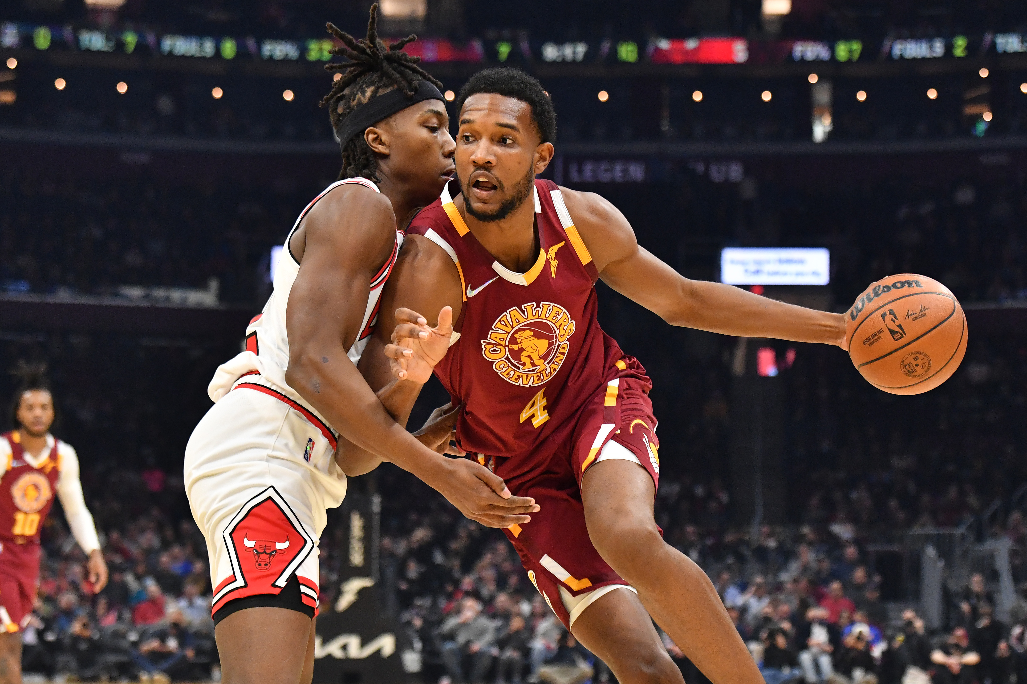 Cleveland Cavaliers rookie Evan Mobley drives on Chicago Bulls guard Ayo Dosunmu during an NBA game in December