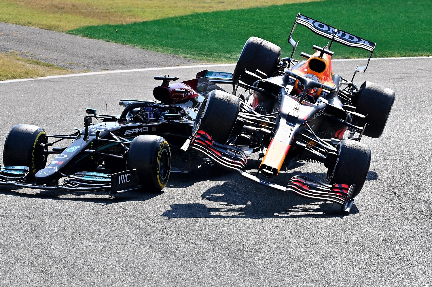 Max Verstappen, driving the Red Bull Racing Honda,  plowed over the top of Lewis Hamilton of the Mercedes AMG Petronas F1 Team during the F1 Grand Prix of Italy at Autodromo di Monza on Sept. 12, 2021. | Peter Van Egmond/Getty Images