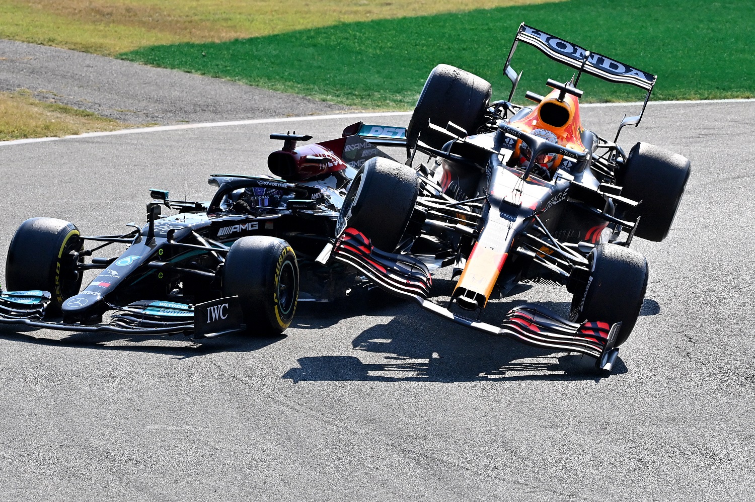 Max Verstappen, driving the Red Bull Racing Honda, plowed over the top of Lewis Hamilton of the Mercedes AMG Petronas F1 Team during the F1 Grand Prix of Italy at Autodromo di Monza on Sept. 12, 2021. | Peter Van Egmond/Getty Images